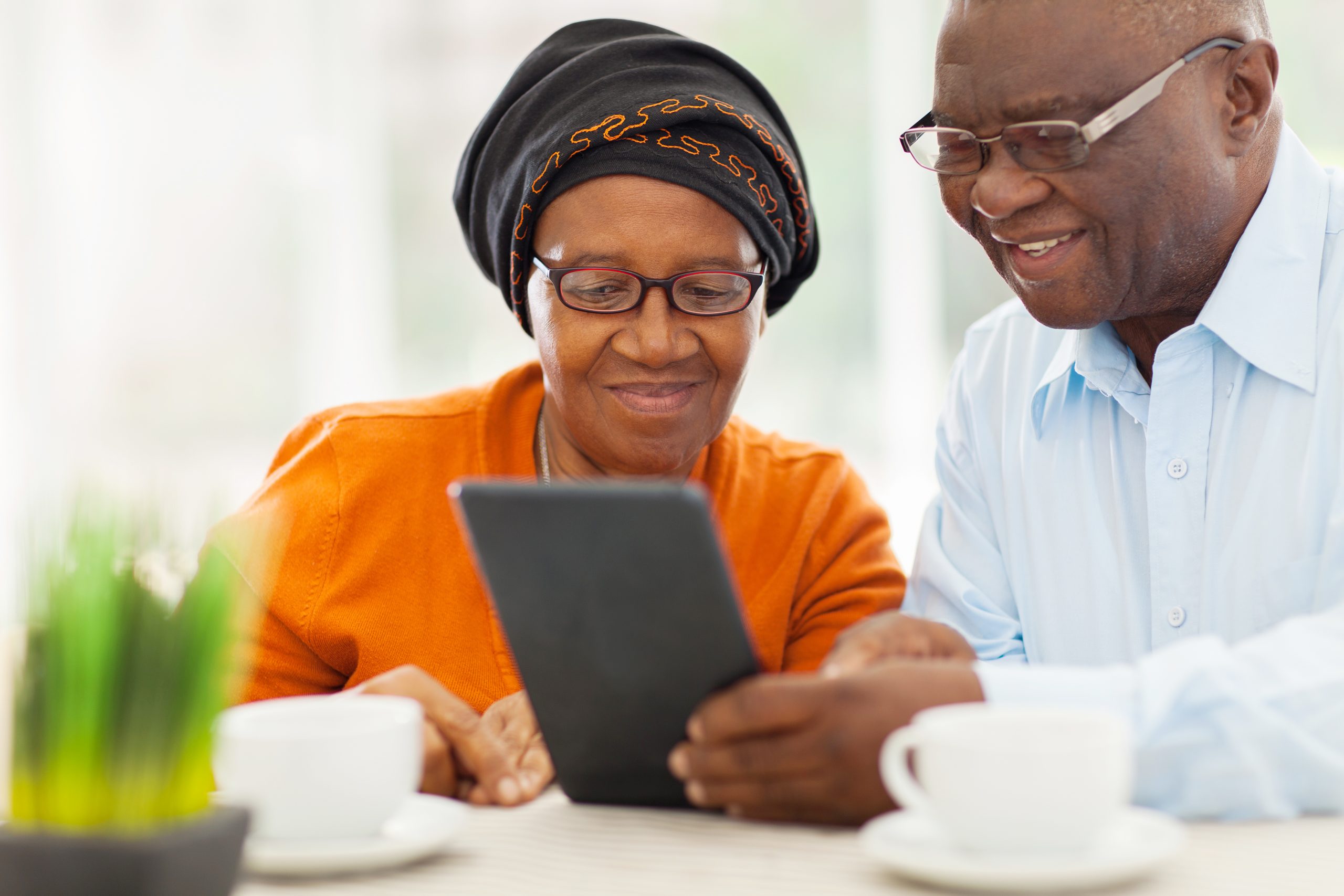 Caregivers view tablet at home