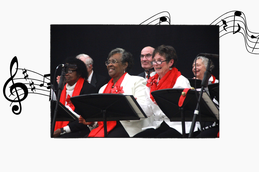 People smiling and standing in concert