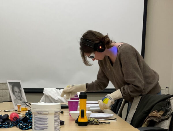 Person wearing goggles and gloves